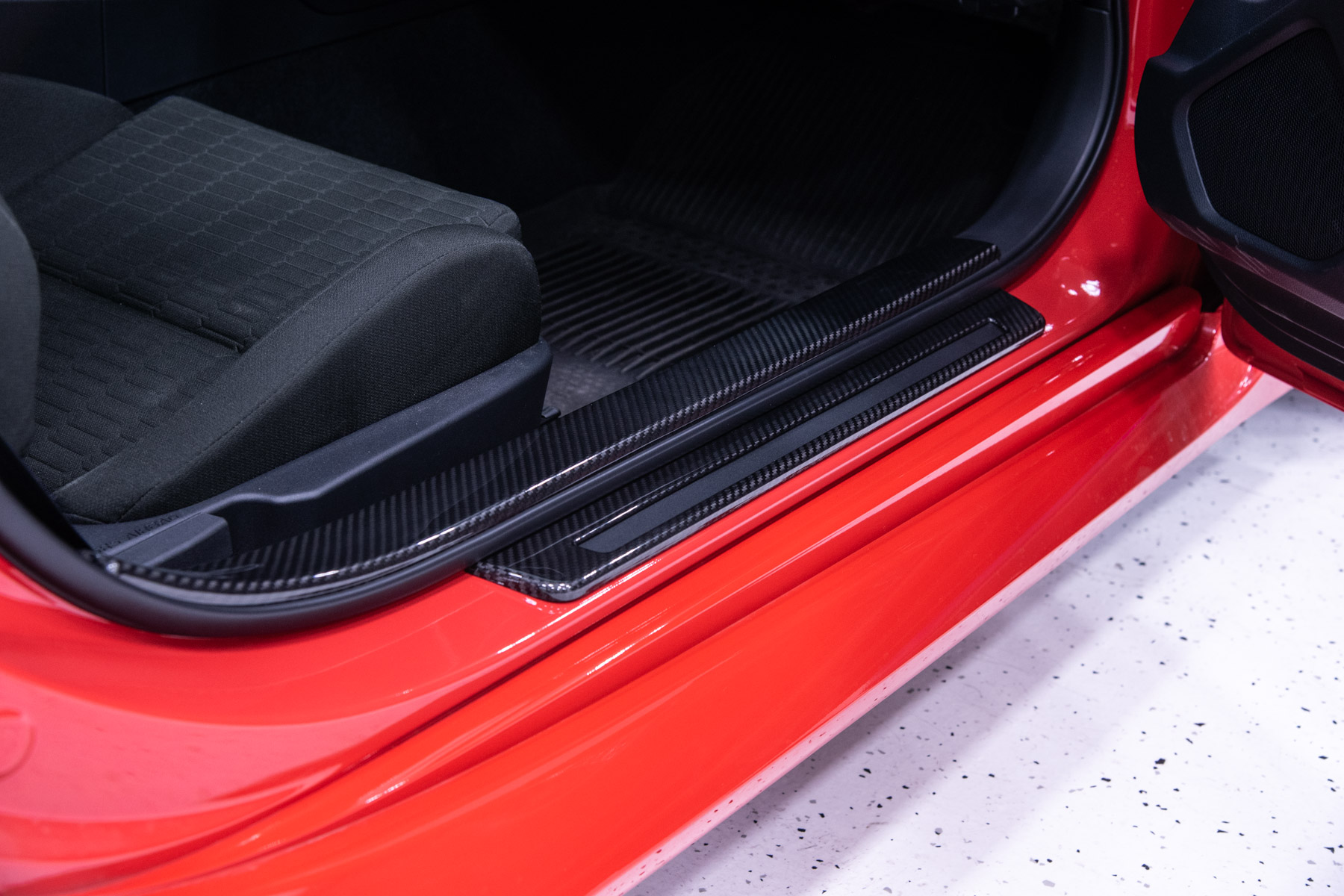 OLM LE Dry Carbon Fiber Door Step Guard Installed on a 2022 Toyota GR86