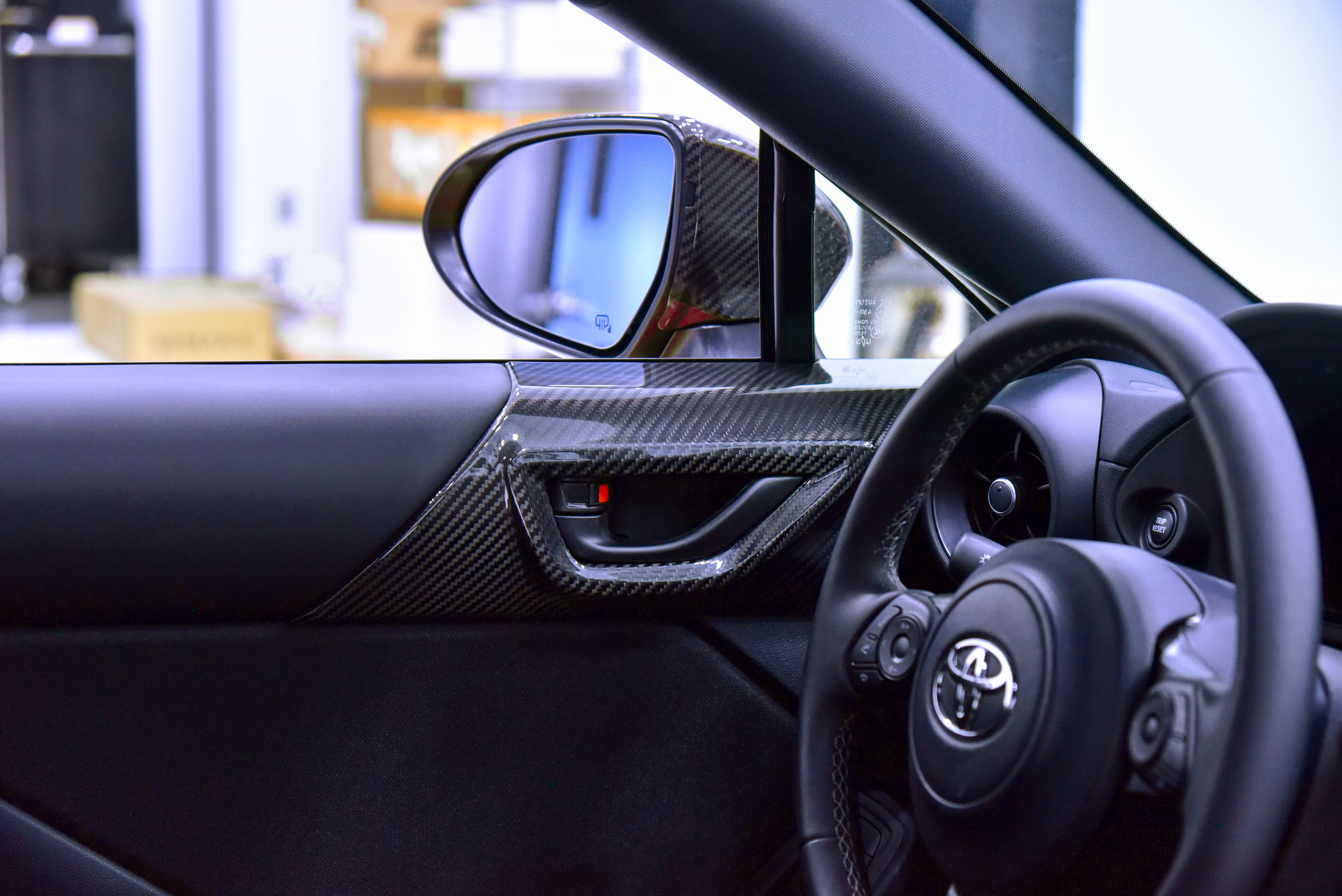 OLM LE Dry Carbon Fiber Inner Door Panel Trim Installed on a 2022 Toyota GR86 
